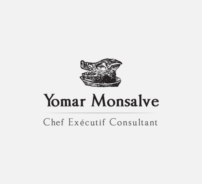 Logo for Yomar Monsalve, designed by Imago Visual, featuring a classical woodcut-style boar’s head on a platter, representing his Venezuelan heritage and Parisian culinary artistry.